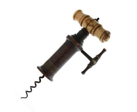 19th century corkscrew of Thomason type, with wire helix, ring turned brass barrel with applied label marked 'Josh. Rodgers /
