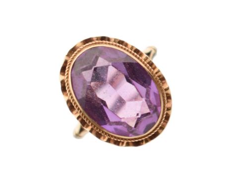 Amethyst 9ct gold dress ring, the faceted oval stone rubover set, Birmingham 1971, size K, 4g gross approx
