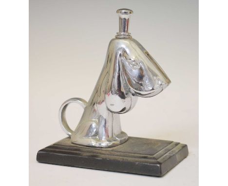Ronson novelty table lighter, formed as a dog, on stepped rectangular base, stamped Art Metal Works AMW 1935, 10cm x 6.5cm x 