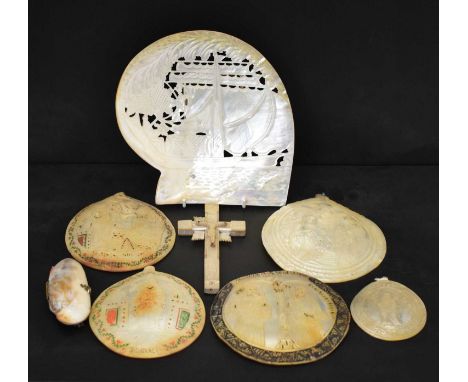 Collection of late 19th century carved mother-of-pearl shells, five depicting religious scenes, together with a larger carved
