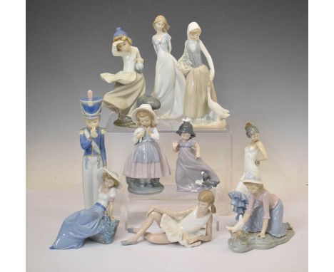 Lladro figure - Cadet with bugle, 31cm high, and nine Nao figurines to include ballet dancer, flamenco dancer etc., 25cm and 