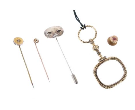 Three stick pins comprising two diamond set, and one white metal, a 9ct gold dress stud, cased, and a yellow metal magnifying