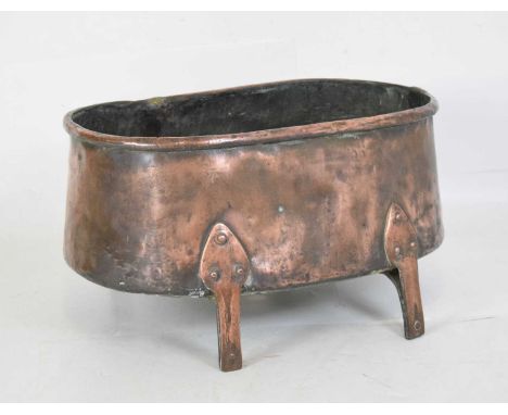 Arts &amp; Crafts copper jardinière or planter, the body of flared rounded oblong section with rolled rim, central internal d