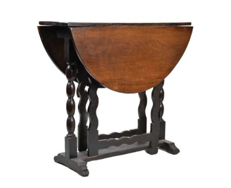 Oak gateleg table of small proportions, circa 1700, the twin-flap top raised on bobbin turned stretched supports and wavy gat