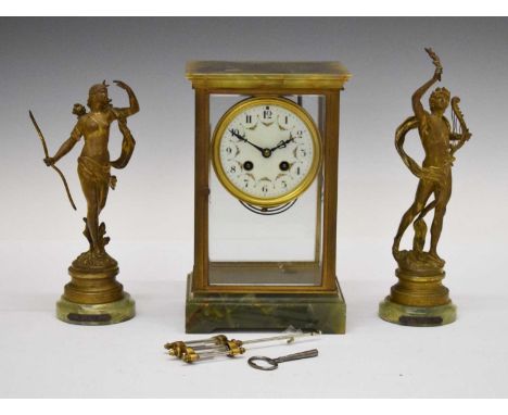 Early 20th Century French green onyx four-glass mantel clock, the white Arabic dial with floral swag decoration, the two-trai