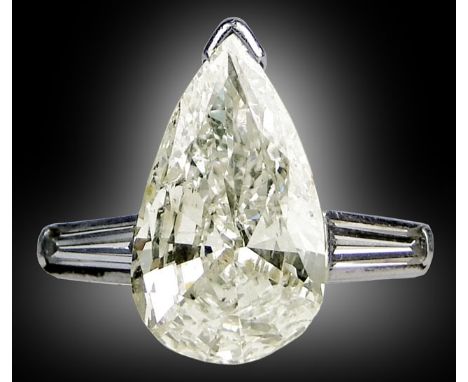 Fine Ladies Approx. 2.0 Pear Shaped Diamond and Platinum Ring. The Diamond of I-J Color and SI-2 Clarity Flanked by Tapered B