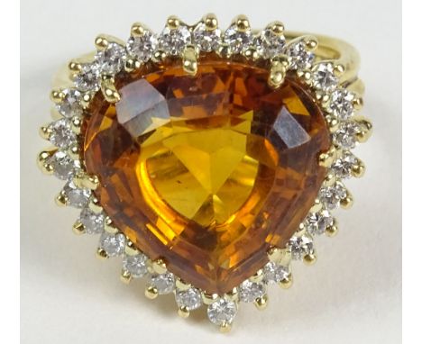 Lady's Fine 18 Karat Yellow Gold Citrine and Diamond Ring. Set with a Center stone of Citrine and surrounded by round Brillia