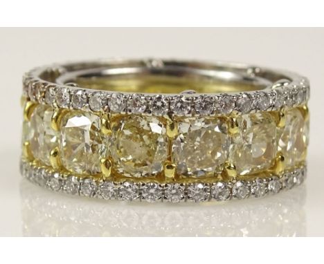 EGL Certified 11.18 Carat Fancy Yellow Diamond, Platinum and 18 Karat Yellow Gold Eternity Band accented with 1.72 Carat Roun