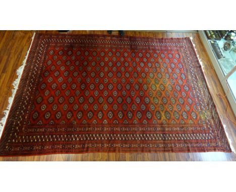 Semi-Antique Bokhara Turkmen Rug. Dealer Tag Attached (faded illegible). One side Faded (Sun) or in Good Condition. Measures 