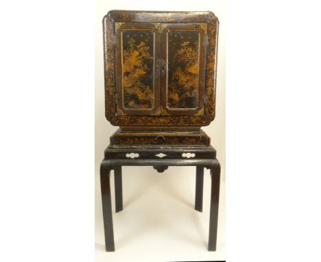 18th Century Chinese Export Lacquer Cabinet on Stand. Highly Decorated with Interior fully lined with shallow Drawers and Com