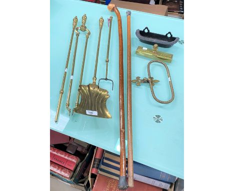 A set of 3 brass fire irons; a stick stand and sticks 