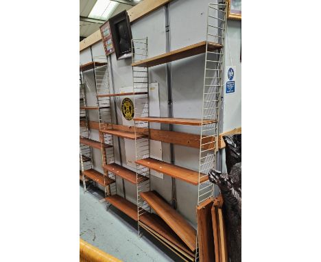 A 1960's STRING Swedish ladder frame bookcase comprising 4 supports and 21 teak shelves; a similar single unit 
