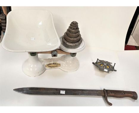 A WWI bayonet; a vintage AA badge; a set of white enamel kitchen scales 