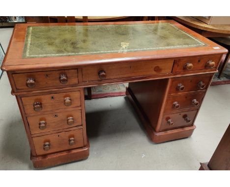 A mahogany pedestal desk with three drawers to each pillar and under desk, with leather top (slight damage) 122 x 65cm 