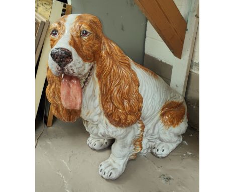 A large mid 20th century Italian pot dog model of a Spaniel with white and light brown patches, height 50cm 