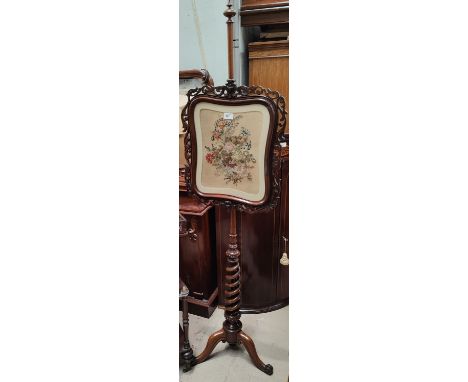 A rosewood pole screen with rosewood framed tapestry picture of flowers, corkscrew pole 