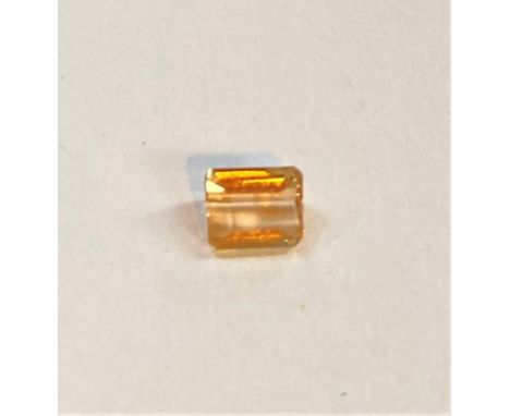 A step cut Imperial Topaz, 0.65 carat, 5.25 x 4.25mm 