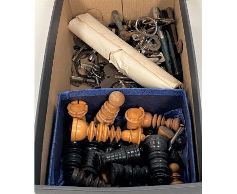 A selection of turned chess pieces, clock keys, vintage fountain pens etc 