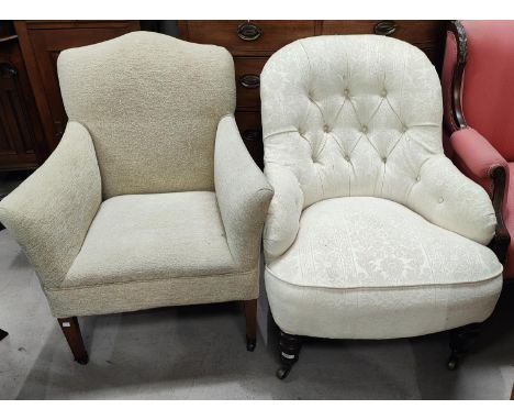 A Victorian button back nursing chair in cream brocade on turned legs; An Edwardian mahogany armchair in cream fabric on tape