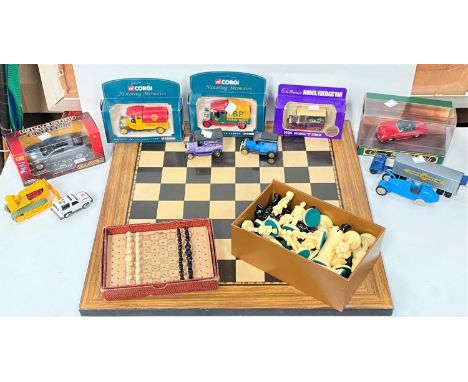 A selection of boxed and loose diecast cars; a chess set and board; an artist's easel 