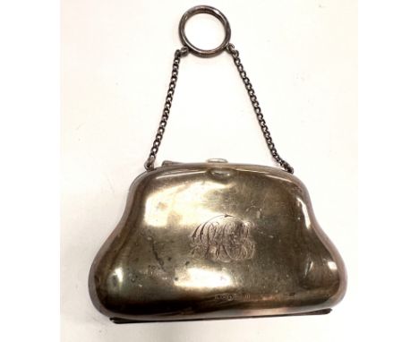 A hallmarked silver purse on the form of a&nbsp; hand bag;&nbsp; three hallmarked silver napkin rings and two enamel spoons a