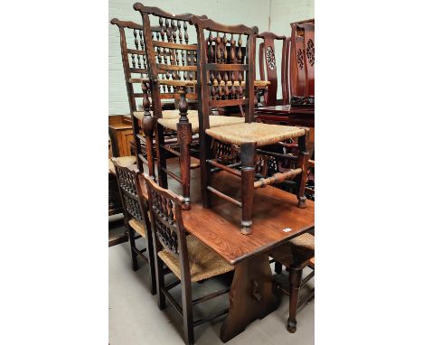 A matched set of eight (6 + 2) rush seat Lancashire bobbin back chairs 