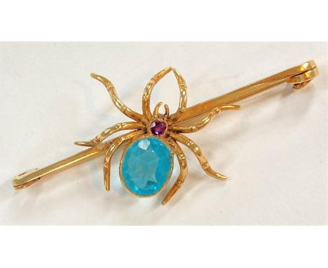 A spider bar brooch set light blue stone, stamped '18ct', 8.75 gm 