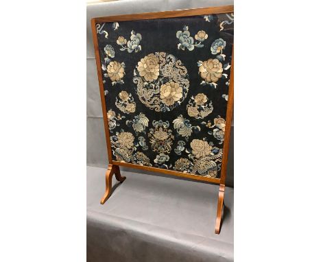 Chinese embroidered silk panels set within a fire screen. The silk probably 19th century