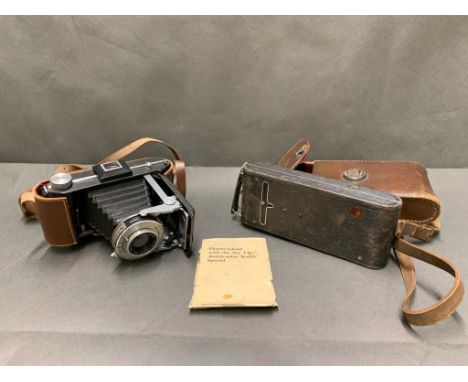 2 antique kodak cameras in leather cases