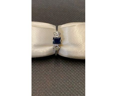 A ladies 18 carat white gold sapphire and diamond ring. Not hallmarked, tested 18 carat. The diamonds are each approx 0.10 ca