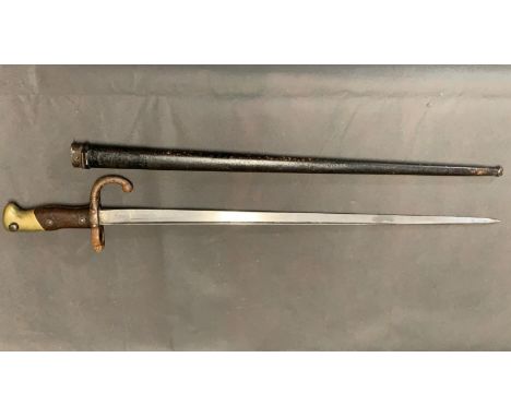 An antique bayonet with scabbard