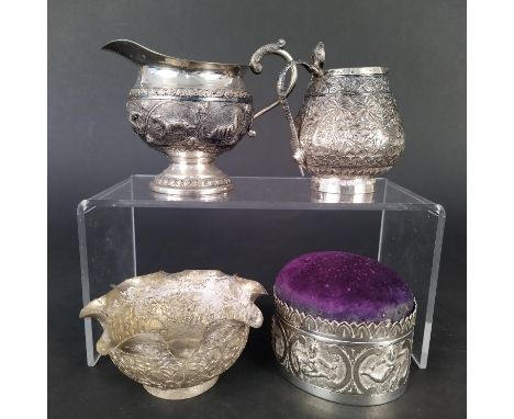 A mixed lot of Indian white metal items including jugs, a bowl and a trinket box