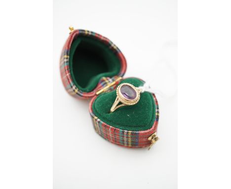 A 9ct gold and amethyst dress ring, in a heart-shaped tartan ring box, L, 1.4g