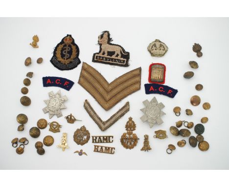 A quantity of British Army and other cap badges and cloth insignia