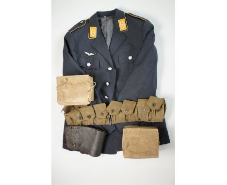 A German air force tunic, two Second World War British civilian gas masks, Home Guard type leather anklets and a US Army webb