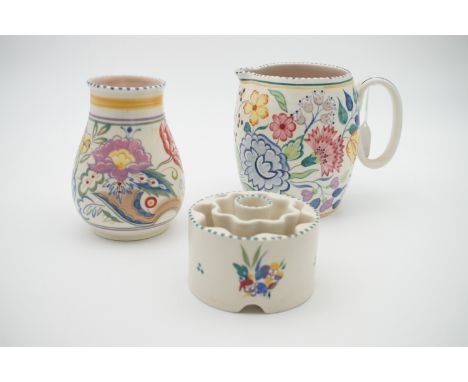 An early Poole Pottery vase, jug, butter dish, plate and posy holder