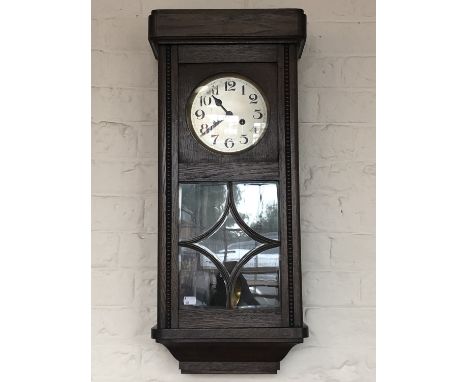 A 1930s - 1940s oak wall clock, 32 x 16 x 76 cm