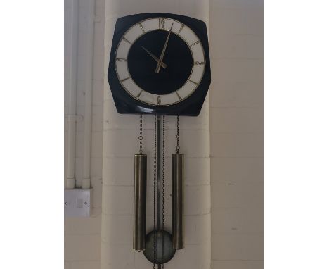 A 1960s Kienzle weight-driven wall clock
