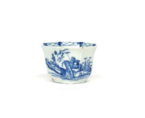 A Worcester blue and white octagonal teabowl  c.1756, painted with the Romantic Rocks pattern, a traveller climbing a precipi