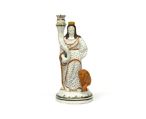A large Pratt ware candlestick figure  c.1810, modelled as the goddess Cybele, holding a long cornucopia supporting a candle 