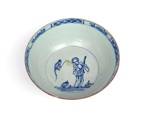 A large delftware punchbowl  c.1750-70, painted in blue to the interior with a single Chinese figure together with a bird on 