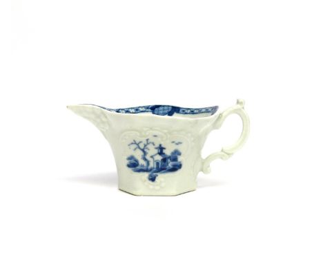A Worcester blue and white creamboat  c.1760, of hexagonal form, moulded with a geranium leaf beneath the spout, painted with