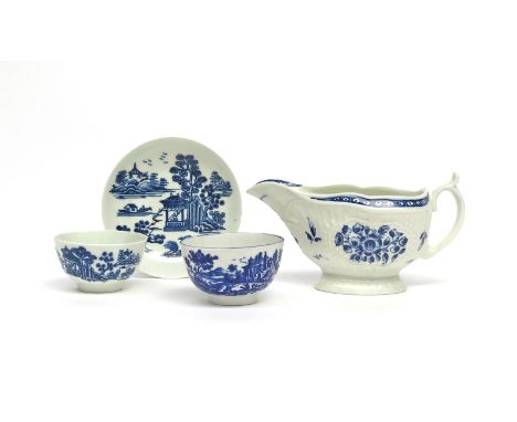 A Worcester blue and white teabowl and saucer   c.1775, printed with the Man in the Pavilion pattern, another Worcester teabo
