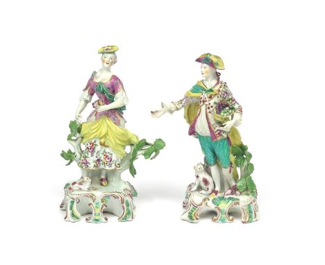 A pair of Derby figures of the Dresden Shepherds  c.1765, he holding a basket of fruit and holding out a single berry, his co