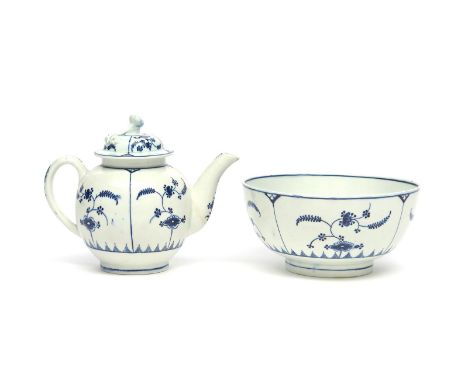 A Lowestoft blue and white teapot and cover with slop bowl  c.1775, painted in the Immortelle pattern with loose flower spray