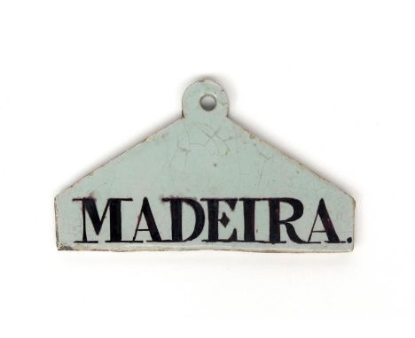 A delftware bin label  c.1770-80, of coathanger form, inscribed 'Madeira' in manganese, 13.4cm.