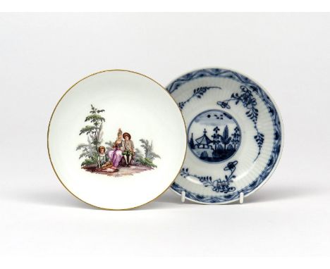Two Meissen saucers  c.1730-40, one painted in polychrome enamels with a couple seated on a rocky outcrop, a musician reclini