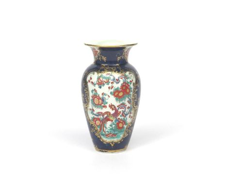 A Worcester vase c.1765, painted in the Rich Kakiemon manner with large panels of long-tailed birds above and beneath bold fl