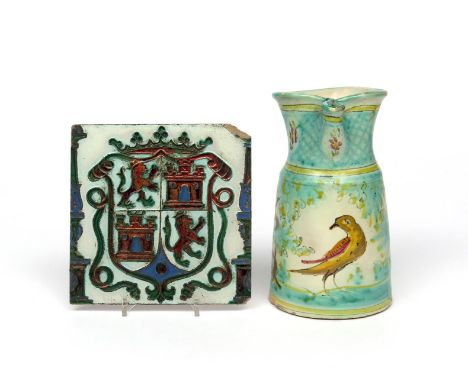 A Talavera or Puente del Arzobispo maiolica jug  mid 18th century, painted with a bird beneath trees, and a Manises cuerda se