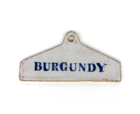 A rare delftware bin label  c.1770-80, of coathanger form, inscribed in blue with 'Burgundy', 13.4cm.